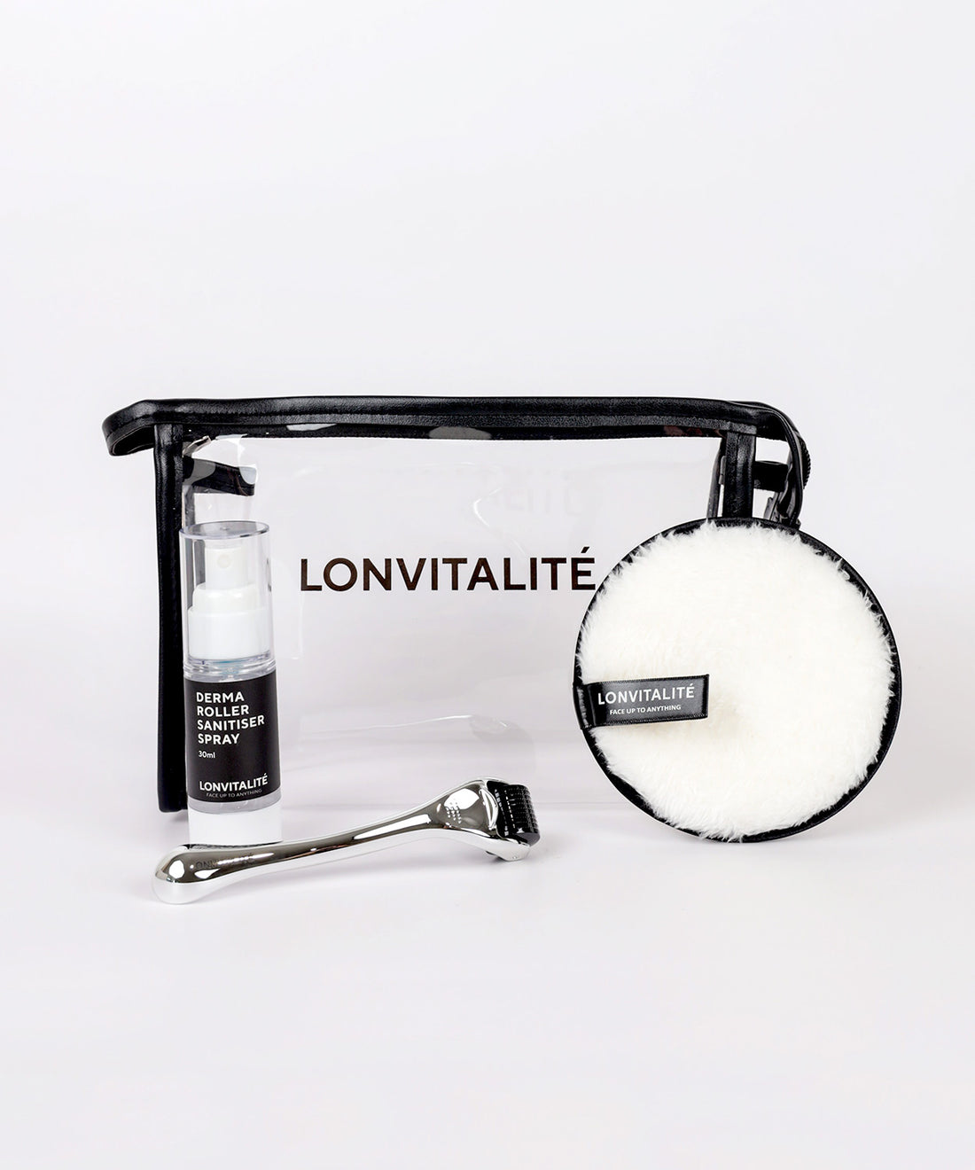 A skincare kit including a Lonvitalite face derma roller, a sanitiser spray, and reusable makeup pads, displayed on a white background.